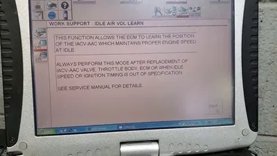 An automotive diagnostic scan tool screen displaying the throttle relearn or idle air volume learning function.